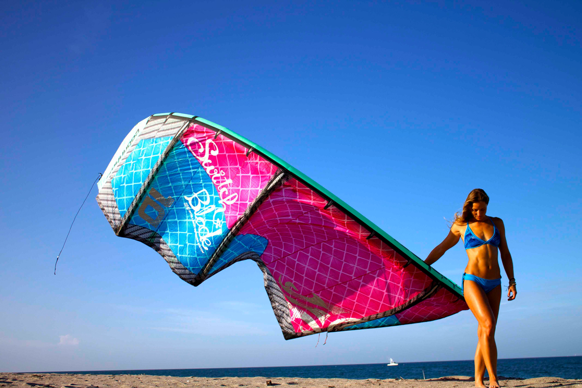 Melissa Gil with the Cabrinha Switchblade kite - in bikini on the beach
