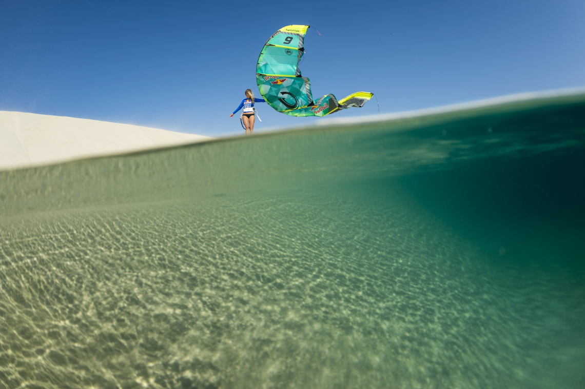 Susi Mai just hanging out with her Cabrinha kite on a sand dune