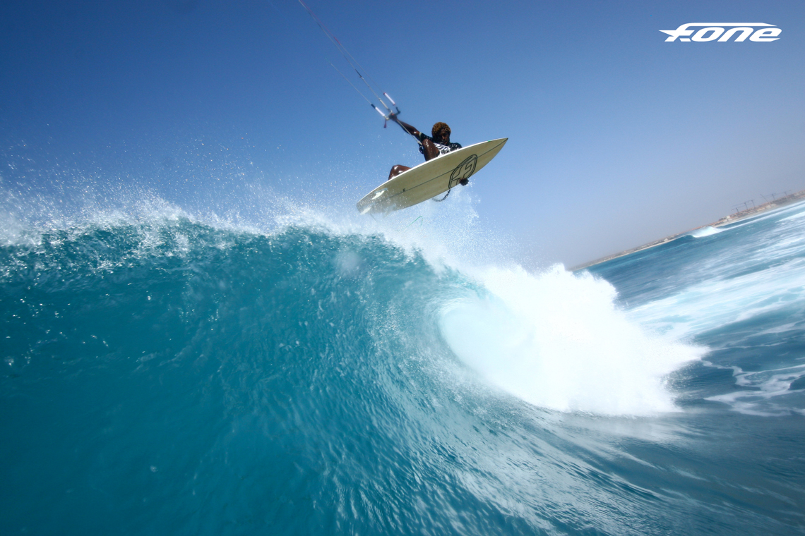 Kitesurfer Mitu Monteiro getting some air off a nice wave - fone kites