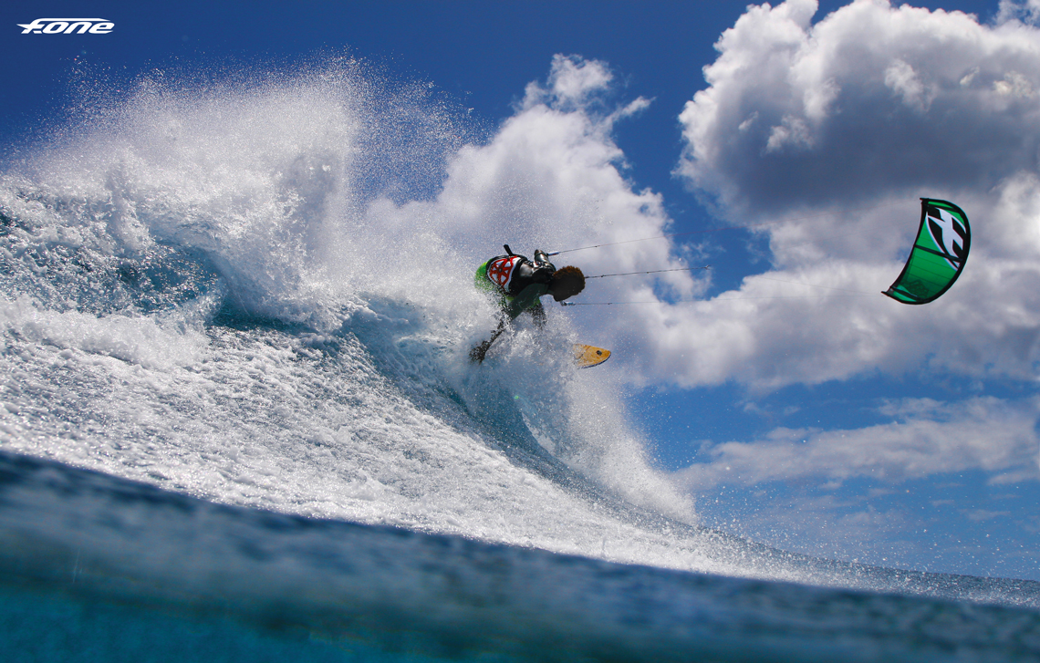 Backside shred by Mitu Monteiro off a wave and on the F-One Bandit kite.