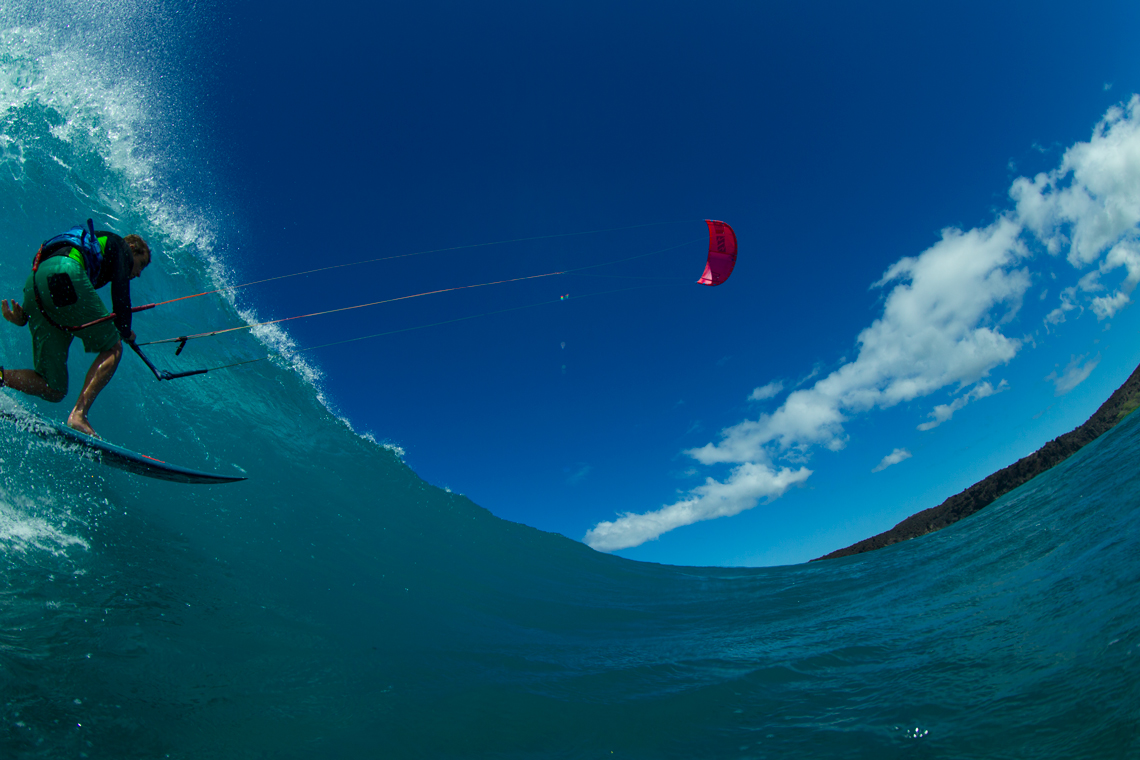 A kiteboarder - Patri Mclaughlin - with the North Kiteboarding 2016 Neo kite riding a wave.