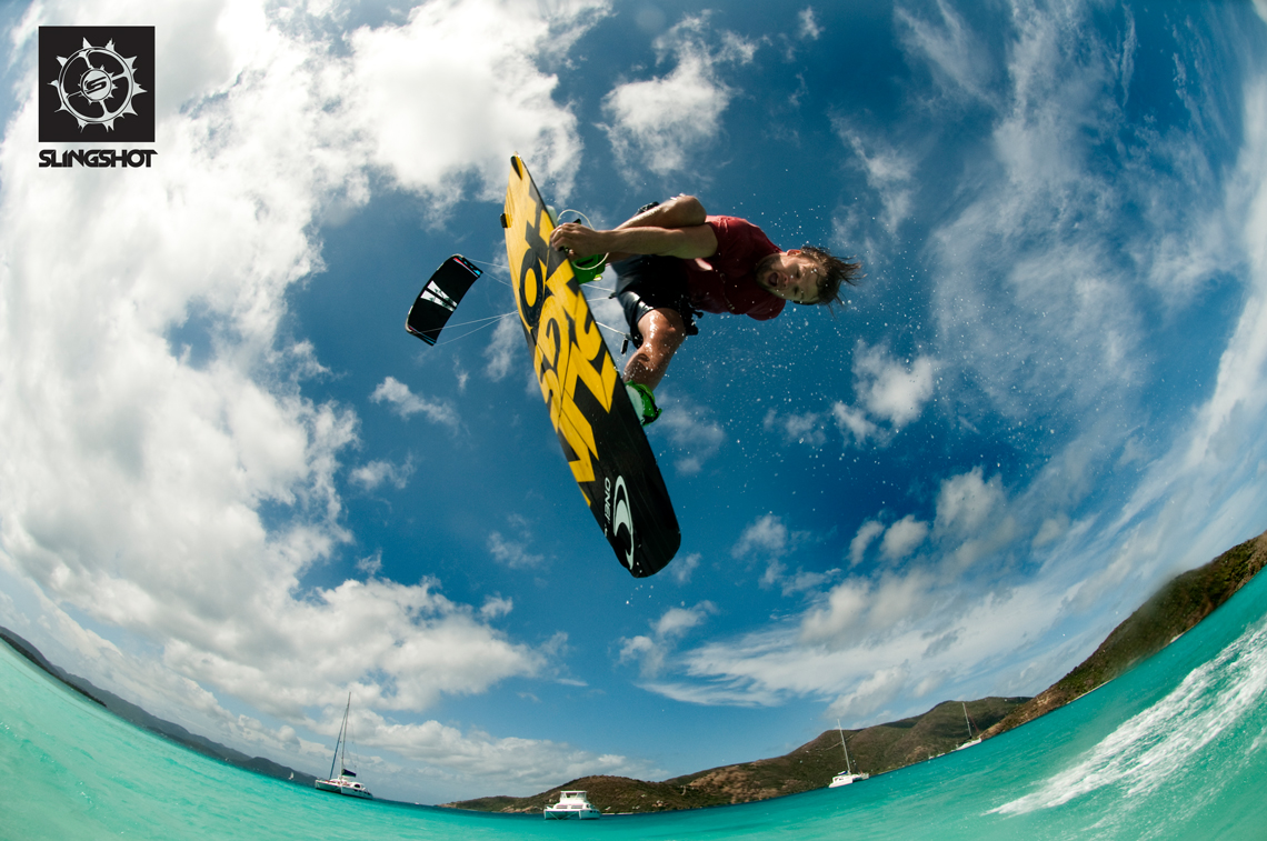 Sam Light kitesurfing on the 2015 Slingshot Fuel and Asylum board - inverted over lagoon