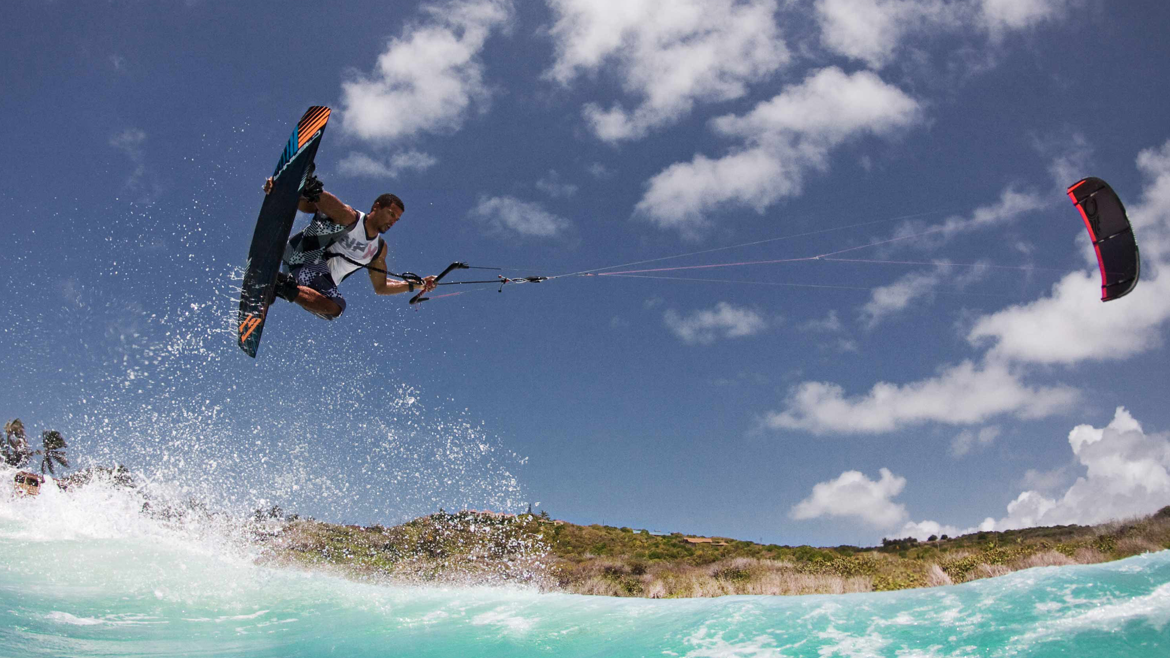 kitesurf wallpaper image - Andre Phillip with a nice grab over the surf - in resolution: High Definition - HD 16:9 2400 X 1350