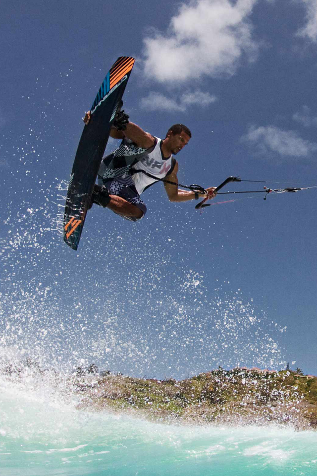kitesurf wallpaper image - Andre Phillip with a nice grab over the surf - in resolution: iPhone 640 X 960