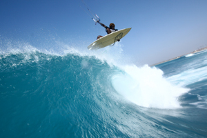 Kitesurfer Mitu Monteiro getting some air off a nice wave - fone kites