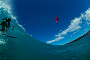 A kiteboarder - Patri Mclaughlin - with the North Kiteboarding 2016 Neo kite riding a wave.