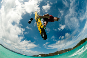 Sam Light kitesurfing on the 2015 Slingshot Fuel and Asylum board - inverted over lagoon